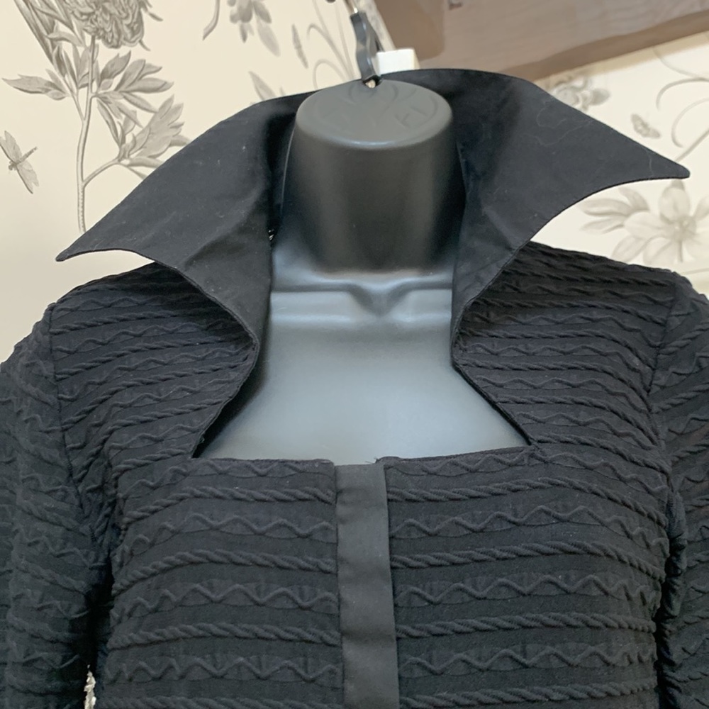 Stretchy snap front black top really unique